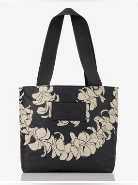 NWT Aloha Collection Mini Tripper 
🌺(plumeria Lei sandstone on black)🌺